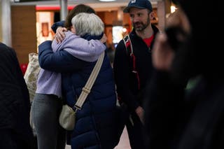 Passengers arrive at Stansted Airport in Stansted, England, Friday, 6 March 2026, on a government-chartered plane from Muscat, Oman